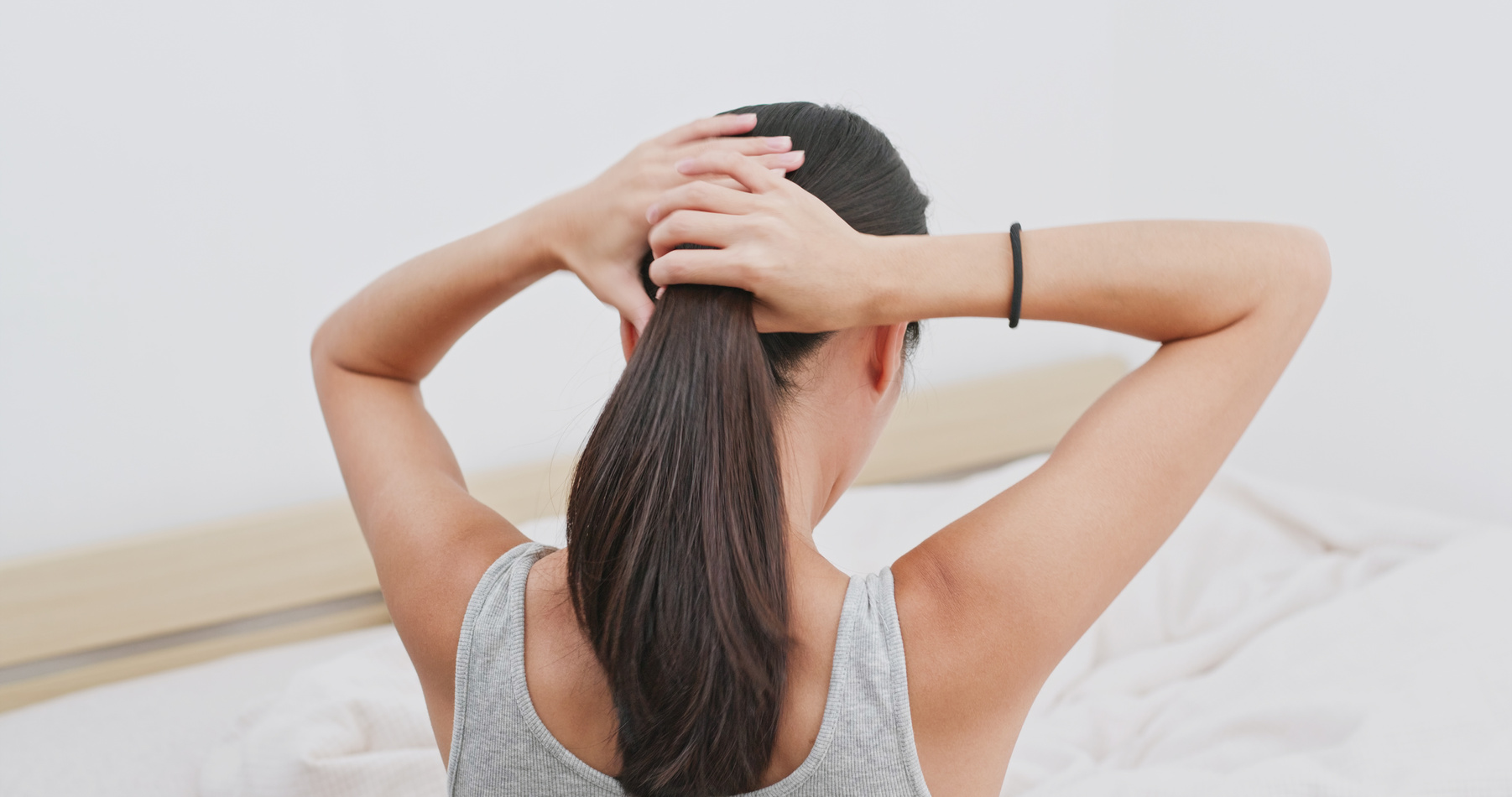 Woman Tied Her Hair at Home